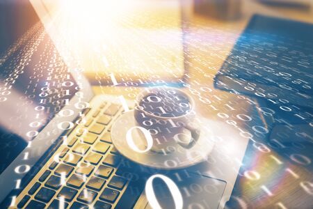 Double exposure of desktop computer and technology theme hologram. Concept of software development.