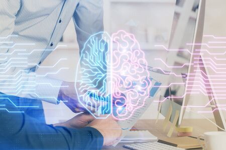 Man with computer background with brain theme hologram. Concept of brainstorm. Double exposure.
