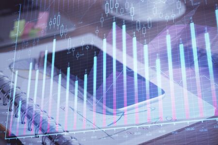 Double exposure of forex chart drawing and cell phone background. Concept of financial data analysisの写真素材