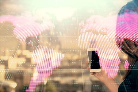 Double exposure of business theme sketch hologram and woman holding and using a mobile device.