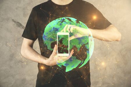 Double exposure of mans hands holding and using a phone and social network theme drawing.