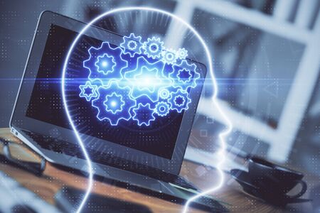 Double exposure of work table with computer and brain sketch hologram. Brainstorming concept.