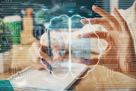 Multi exposure of writing hand on background with brain hologram. Concept of learning.