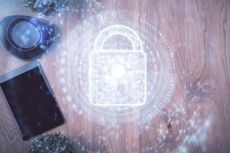 Double exposure of lock drawing over desktop. Top view. Security concept.の写真素材