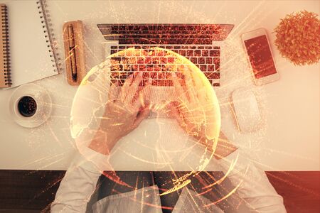 Double exposure of woman hands working on computer and social network theme hologram drawing. Top View. People connection concept.の写真素材