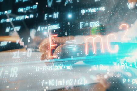 Double exposure of formula drawing over people taking notes background. Concept of educationの写真素材