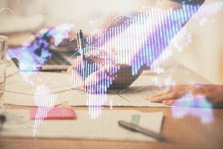 Double exposure of woman hands typing on computer and business theme hologram drawing. Success concept.の写真素材