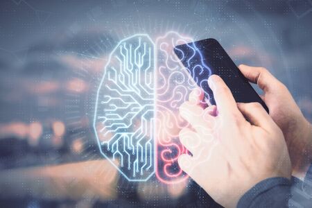 Double exposure of mans hand holding and using a digital device and brain hologram drawing. Data concept.の写真素材