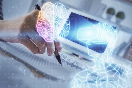 AR hologram over womans hands taking notes background. Concept of augmented reality. Multi exposureの写真素材