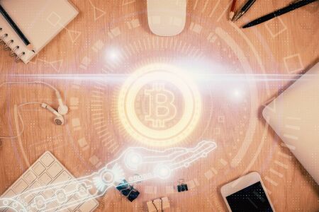 Double exposure of blockchain theme hologram over table with phone. Top view. Crypto technology concept.の写真素材