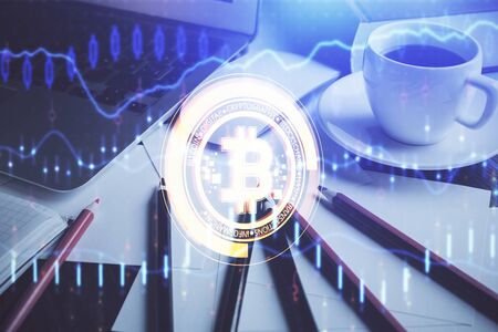 Multi exposure of blockchain and crypto economy theme hologram and table with computer background. Concept of bitcoin cryptocurrency.の写真素材