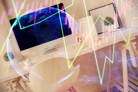 Double exposure of financial graph drawing and office interior background. Concept of stock market.の写真素材