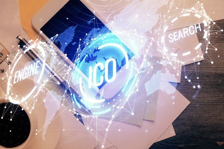 Double exposure of blockchain theme hologram over table with phone. Top view. Crypto technology concept.の写真素材