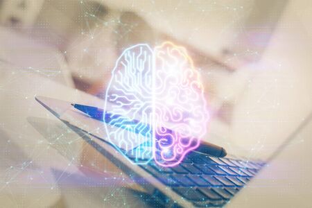 Double exposure of work space with computer and human brain drawing hologram. Brainstorm concept.の写真素材