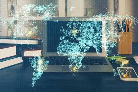 Computer on desktop with social network theme icon. Multi exposure. Concept of international connections.の写真素材