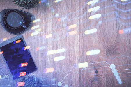 Double exposure of technology theme drawing over work table desktop. Top view. Global data analysis concept.の写真素材