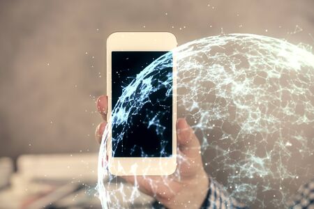 Double exposure of mans hands holding and using a phone and social network theme drawing.の写真素材