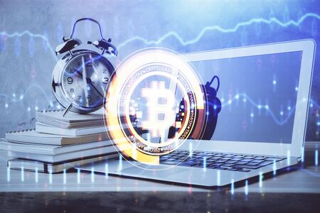 Double exposure of blockchain and crypto economy theme hologram and table with computer background....