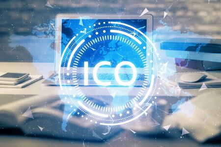 Multi exposure of blockchain theme hologram and table with computer background. Concept of bitcoin crypto currency.の写真素材