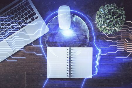 Double exposure of brain drawing hologram over topview work table background with computer. Concept...