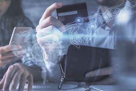 Double exposure of man and woman on-line shopping holding a credit card and brain hologram drawing. Ai and E-commerce pay on-line concept.の写真素材