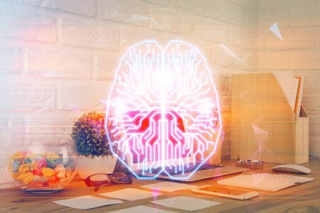 Double exposure of work space with computer and human brain drawing hologram. Brainstorm concept.