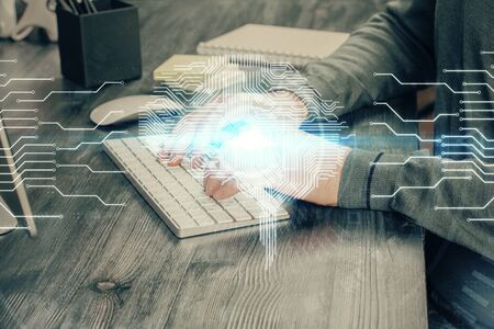 Man typing on keyboard background with brain hologram. Concept of big Data. Double exposure.