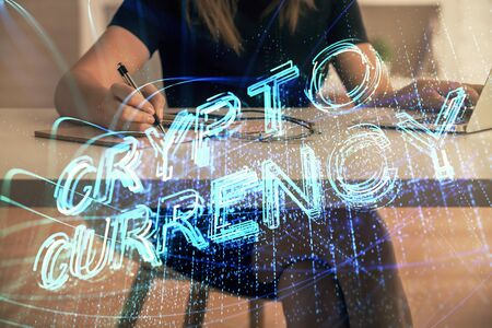 Double exposure of woman hands typing on computer and crypto market theme hologram drawing. Blockchain concept.の写真素材