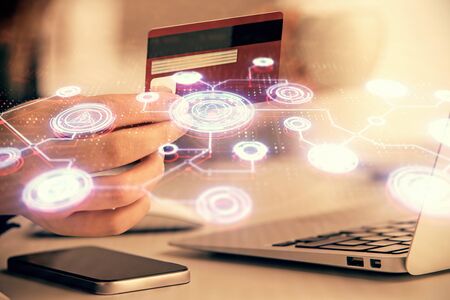 Multi exposure of woman on-line shopping holding a credit card and social network theme drawing. Relationship E-commerce concept.の写真素材