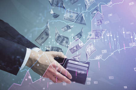 Multi exposure of financial graph drawing hologram and USA dollars bills and man hands. Analysis...