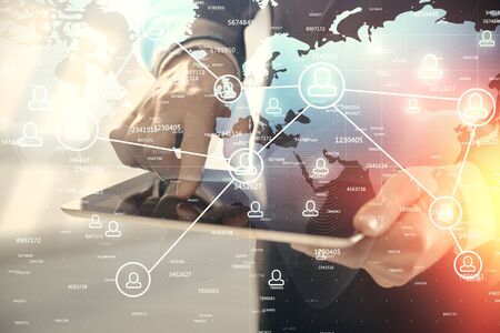 Double exposure of mans hands holding and using a phone and social network theme drawing.