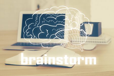 Desktop computer background in office and start up theme hologram drawing. Double exposure. Startup concept.の写真素材