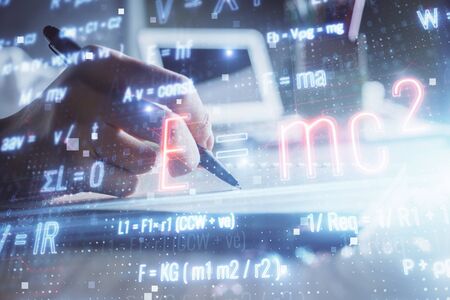 Science formula hologram over womans hands taking notes background. Concept of study. Double...