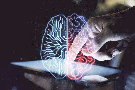 Double exposure of mans hand holding and using a digital device and brain hologram drawing. Data concept.の写真素材