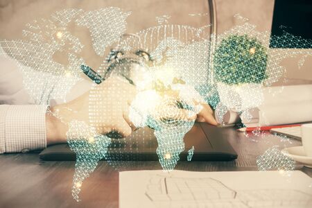 Double exposure of mans hands holding and using a phone and international business theme drawing.の写真素材