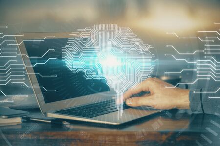 Man typing on keyboard background with brain hologram. Concept of big Data. Double exposure.