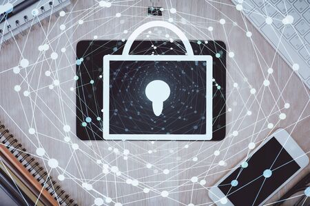 Double exposure of lock drawing over desktop. Top view. Security concept.