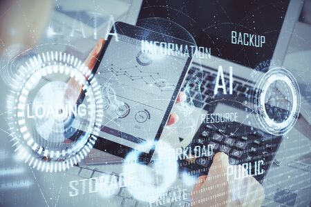 Double exposure of mans hand holding and using a digital device and data theme hologram drawing. Technology concept.の写真素材