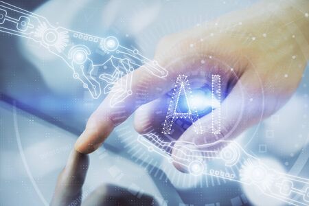 Multi exposure of mans hand holding and using a digital device and data theme drawing. Innovation...