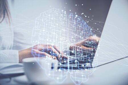Multi exposure of woman hands working on computer and human brain hologram drawing. Ai tech concept.の写真素材