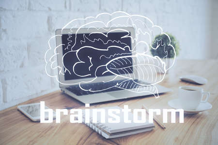 Desktop computer background in office and start up theme hologram drawing. Double exposure. Startup concept.の写真素材