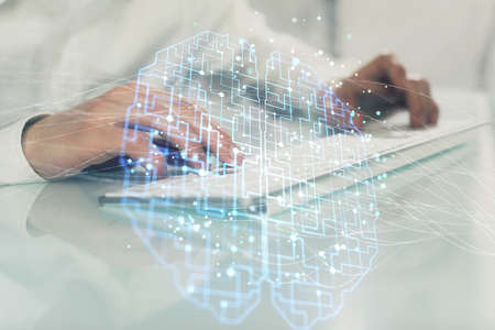 Man with computer background with brain theme hologram. Concept of brainstorm. Double exposure.
