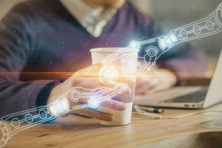 Double exposure of data internet theme hologram with man working on computer on background. Concept...