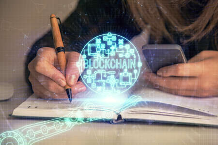 Double exposure of woman hands typing on computer and crypto market theme hologram drawing....
