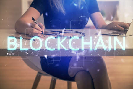 Double exposure of woman hands typing on computer and crypto market theme hologram drawing....