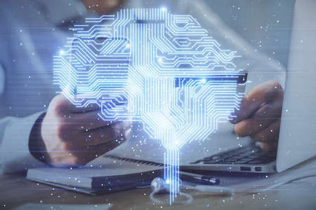 Double exposure of man hands typing on computer with credit card and brain theme drawing. E-commerce...