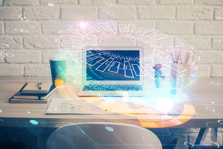 Double exposure of desktop computer and technology theme hologram. Concept of software development.の写真素材