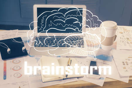 Desktop computer background in office and start up theme hologram drawing. Double exposure. Startup concept.の写真素材