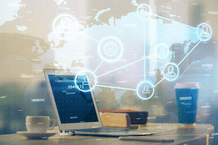 Computer on desktop with social network theme icon. Multi exposure. Concept of international...