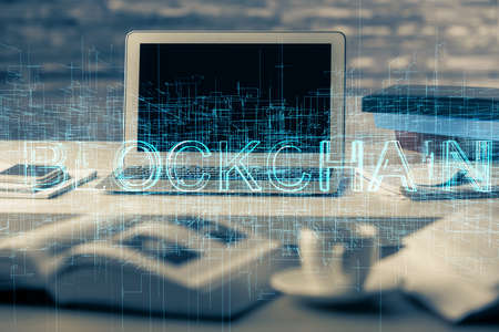 Multi exposure of blockchain theme hologram and table with computer background. Concept of bitcoin...